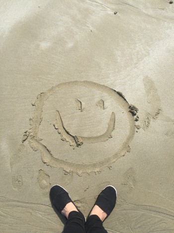 smiley drawing on sand 698899